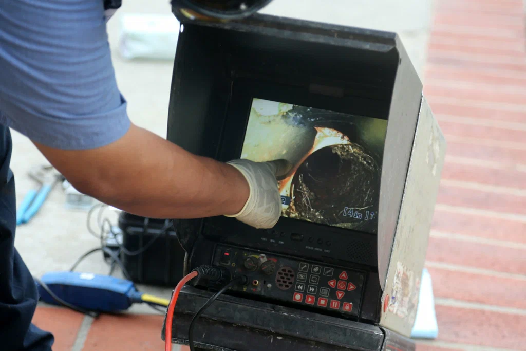Technician viewing a drain inspection camera in Lansdale